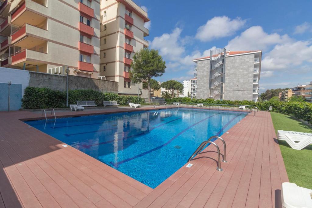 a swimming pool in front of a building at Mariposa 1023 IBERPLAYA in Salou