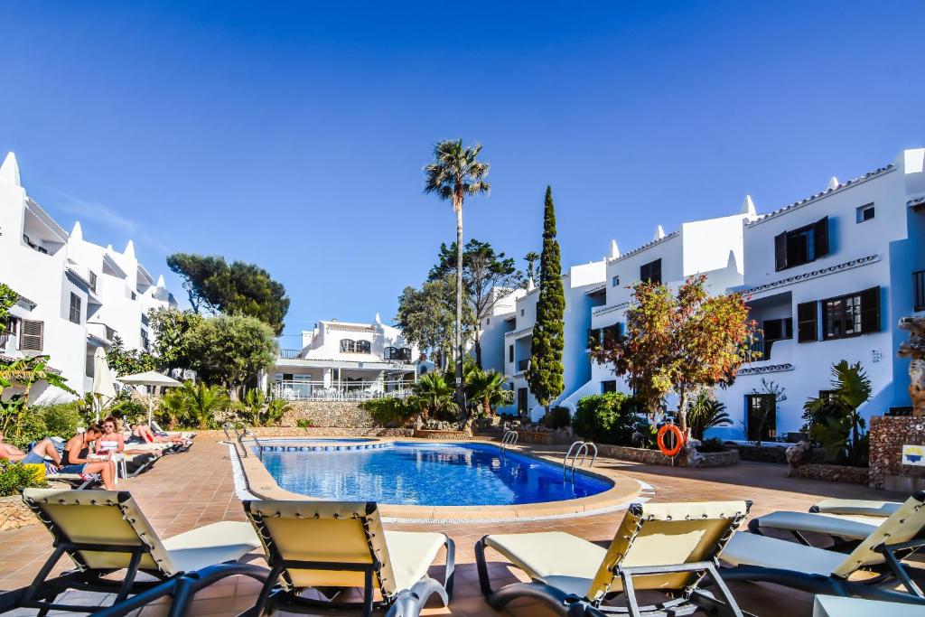 a view of the pool at the resort at Aparthotel Nelva Resort in Cala en Porter