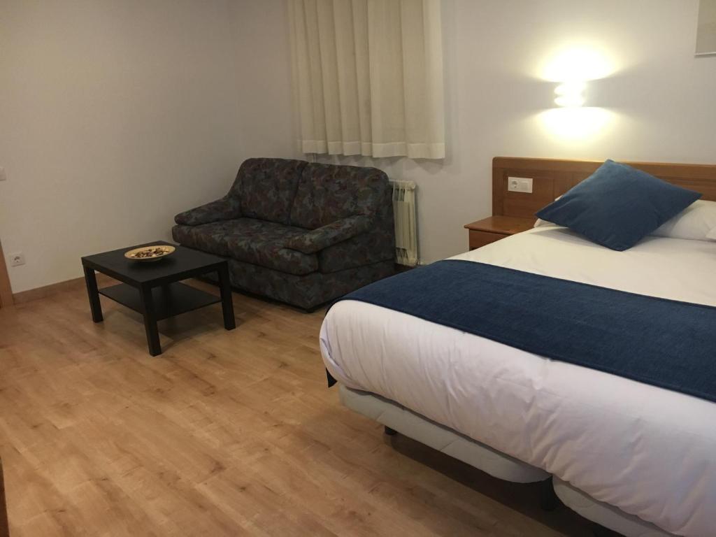 Postel nebo postele na pokoji v ubytování Hotel Marxant