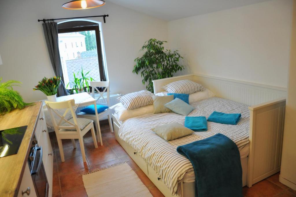 Postel nebo postele na pokoji v ubytování Apartmány U Vavřince