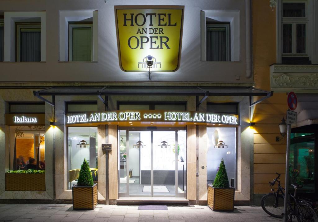 a hotel entrance with a sign over the door at Hotel an der Oper in Munich