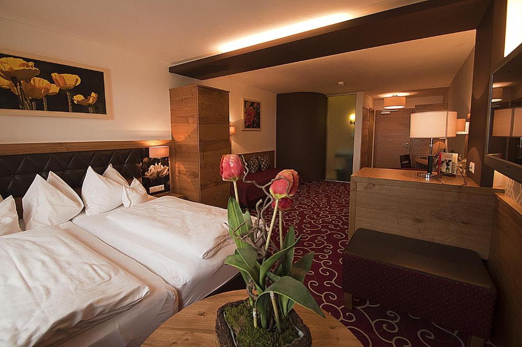 Postel nebo postele na pokoji v ubytování Hotel Rettenberg