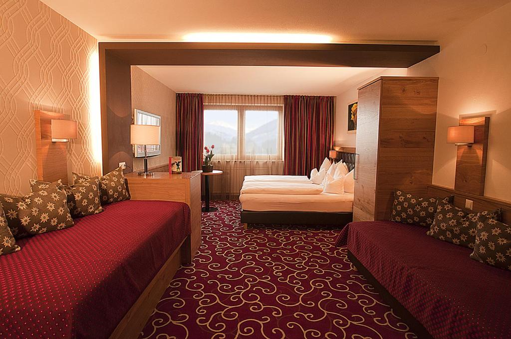 Postel nebo postele na pokoji v ubytování Hotel Rettenberg