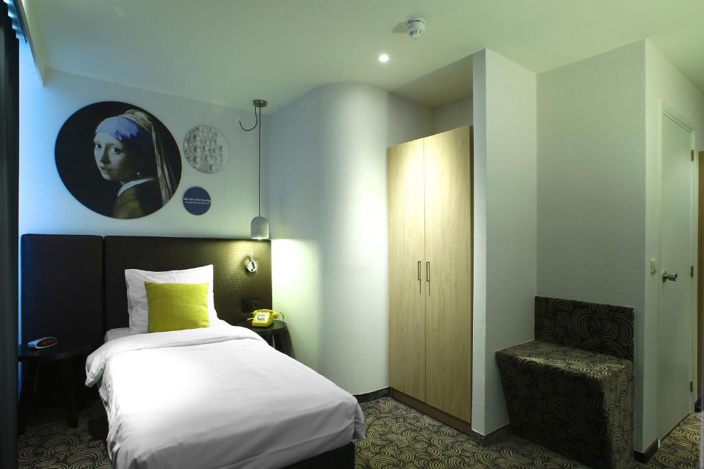 Postel nebo postele na pokoji v ubytování Hotel de Koophandel