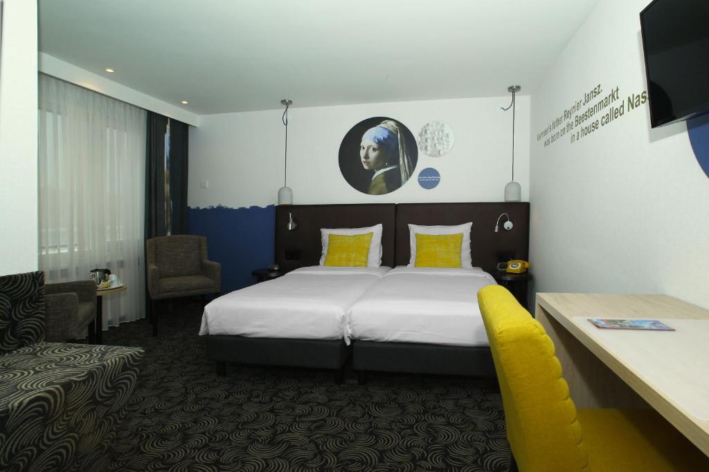 Postel nebo postele na pokoji v ubytování Hotel de Koophandel