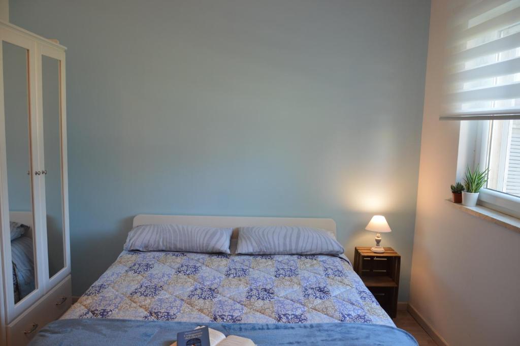 Postel nebo postele na pokoji v ubytování Biblos e Mare