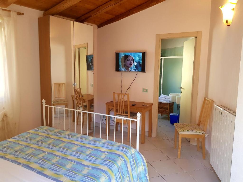 TV a/nebo společenská místnost v ubytování B&B La Pitagora