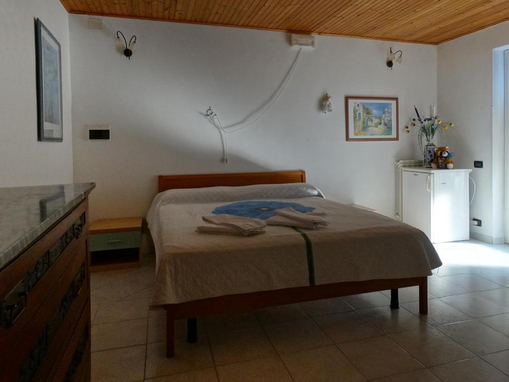 Ένα ή περισσότερα κρεβάτια σε δωμάτιο στο Affittacamere Graziella