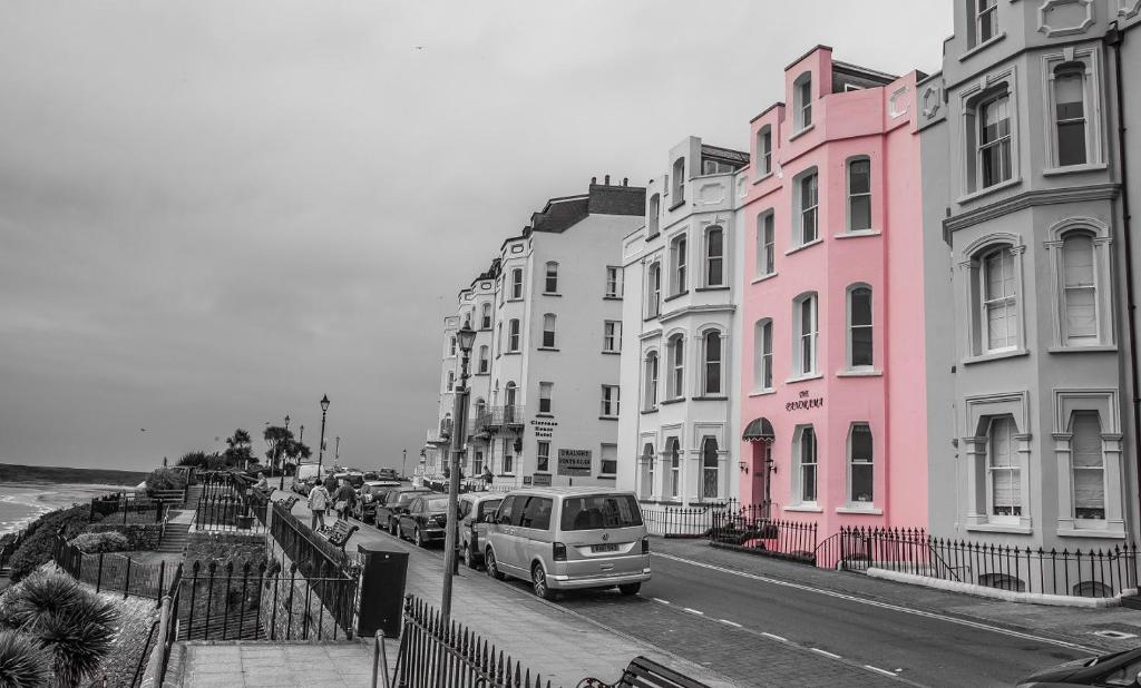 a van parked on a street in front of buildings at Panorama in Tenby