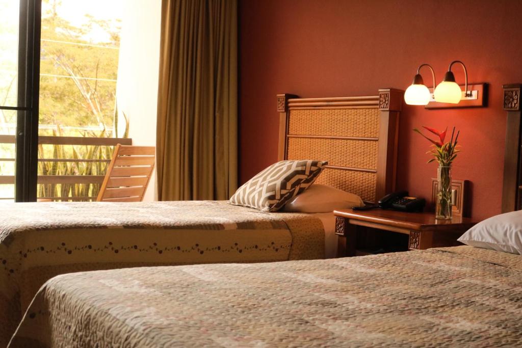 Uma cama ou camas num quarto em Hotel Ladera