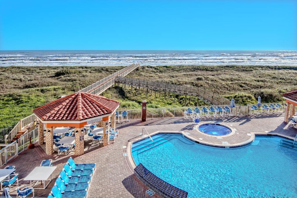 a view of a swimming pool and the beach at La Copa Inn Beach Hotel in South Padre Island