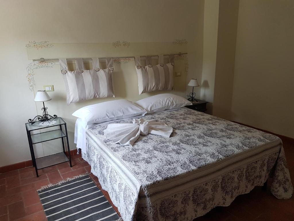 Postel nebo postele na pokoji v ubytování Agriturismo La Quiete