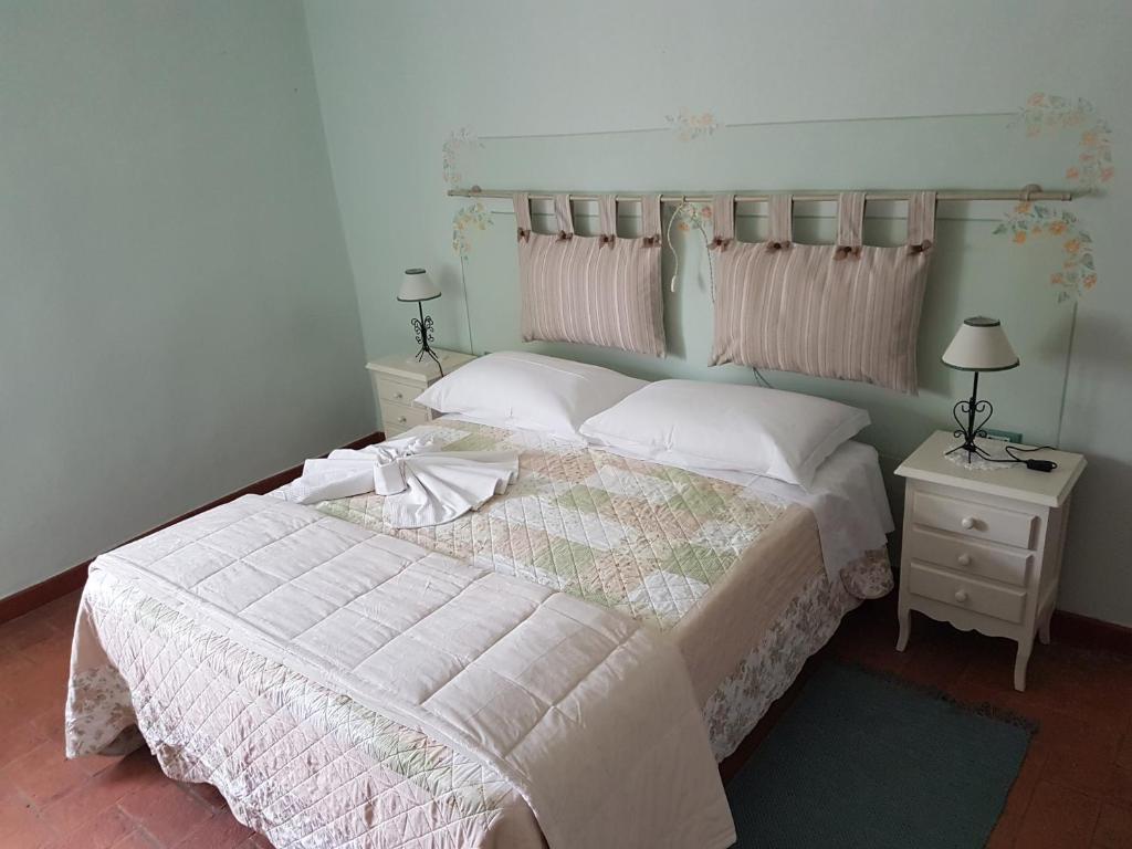 Postel nebo postele na pokoji v ubytování Agriturismo La Quiete