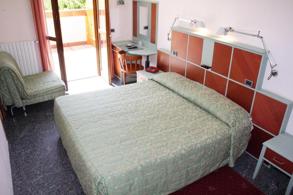 Postel nebo postele na pokoji v ubytování Hotel Derby