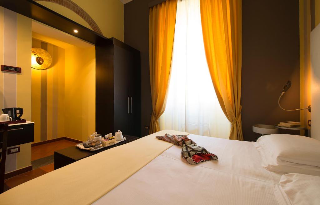 Posteľ alebo postele v izbe v ubytovaní Hotel De La Pace, Sure Hotel Collection by Best Western