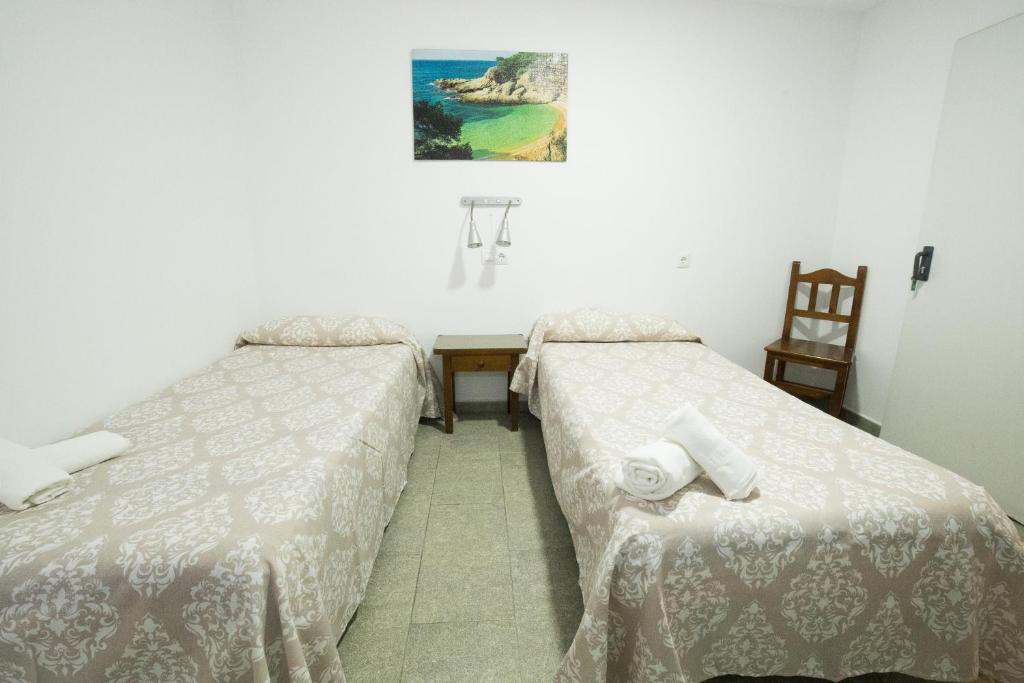 Posteľ alebo postele v izbe v ubytovaní Hospedaje Lisboa Algeciras