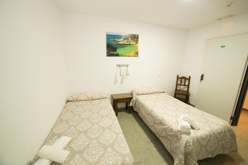 Posteľ alebo postele v izbe v ubytovaní Hospedaje Lisboa Algeciras