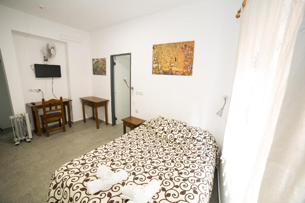 Posteľ alebo postele v izbe v ubytovaní Hospedaje Lisboa Algeciras