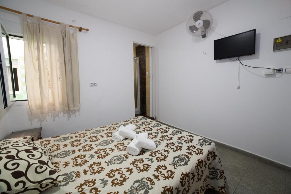 Posteľ alebo postele v izbe v ubytovaní Hospedaje Lisboa Algeciras