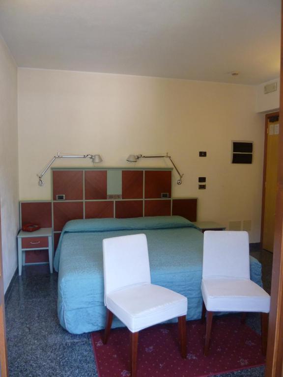 Postel nebo postele na pokoji v ubytování Hotel Derby