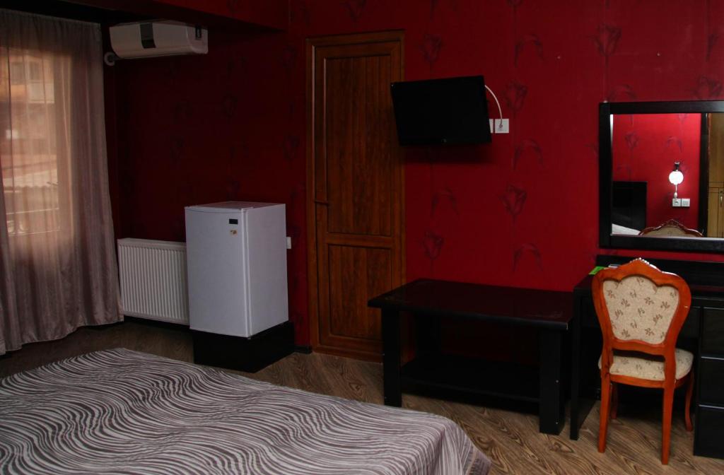 Postel nebo postele na pokoji v ubytování Hotel Obola
