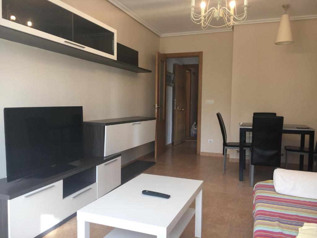 A television and/or entertainment centre at Hotel Azcona