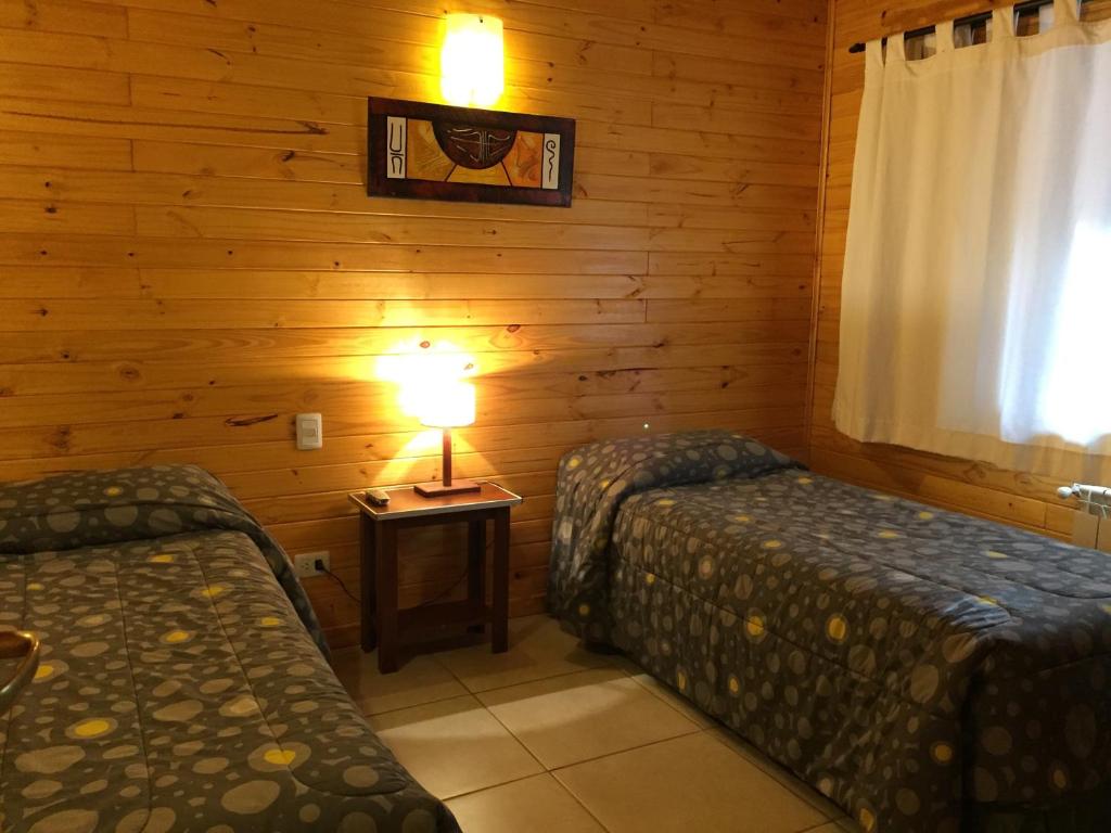Postel nebo postele na pokoji v ubytování Encanto del Rio