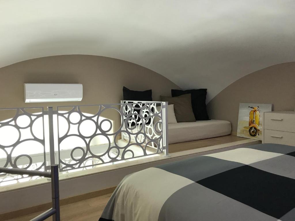 Postel nebo postele na pokoji v ubytování OroVerde Rooms & Suite nel cuore di Trani