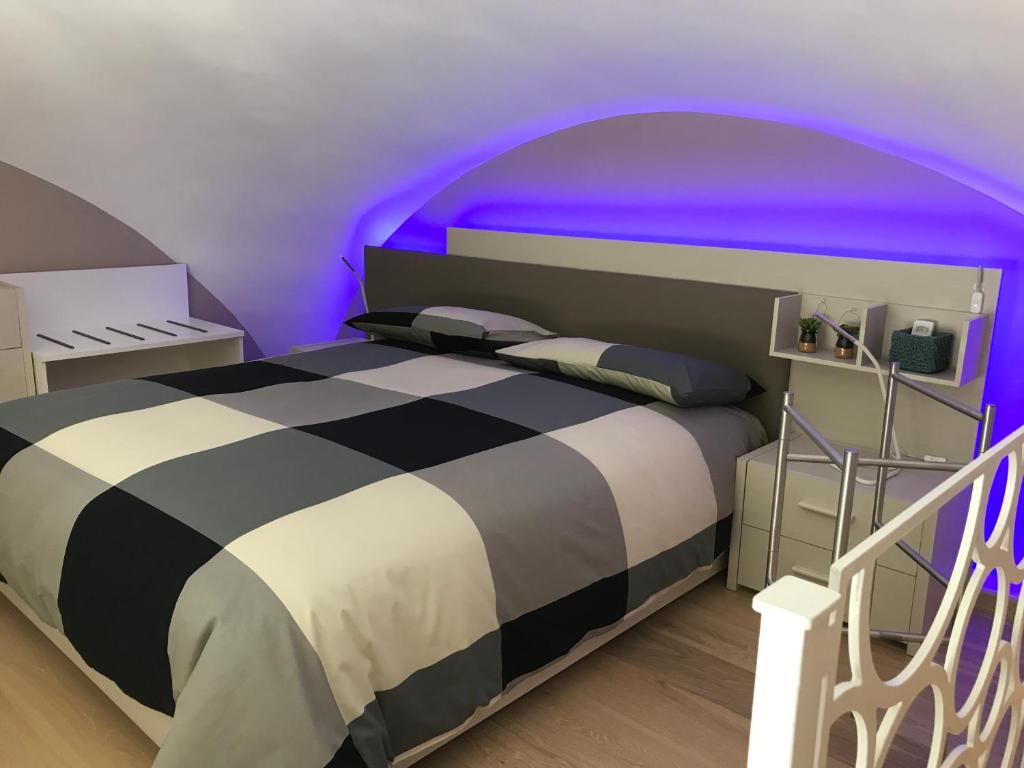 Postel nebo postele na pokoji v ubytování OroVerde Rooms & Suite nel cuore di Trani