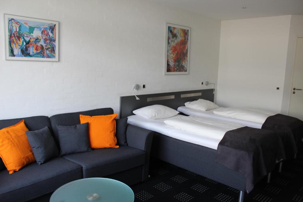 Postel nebo postele na pokoji v ubytování Hotel Hedegaarden