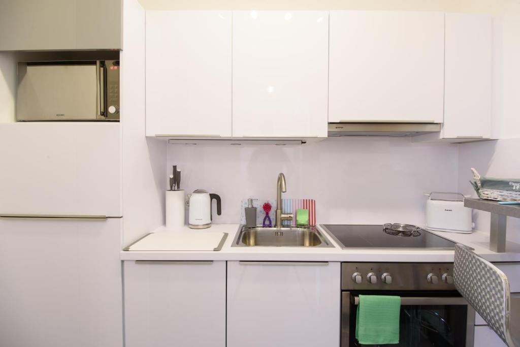 Kuchyň nebo kuchyňský kout v ubytování Design Apartment - Centrally located