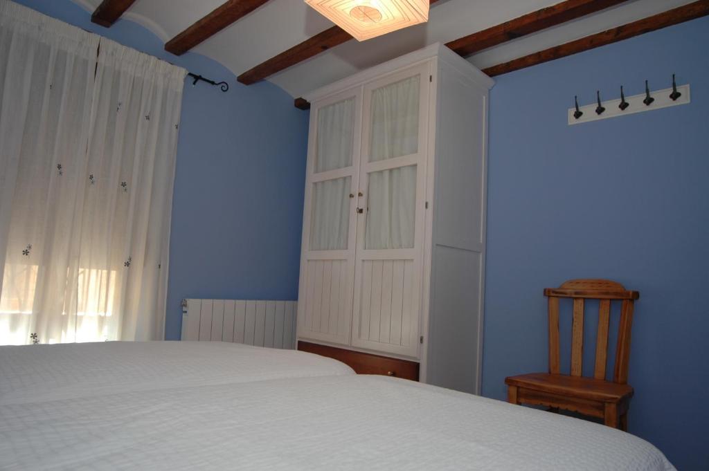 Postel nebo postele na pokoji v ubytování La Casa del Mercat