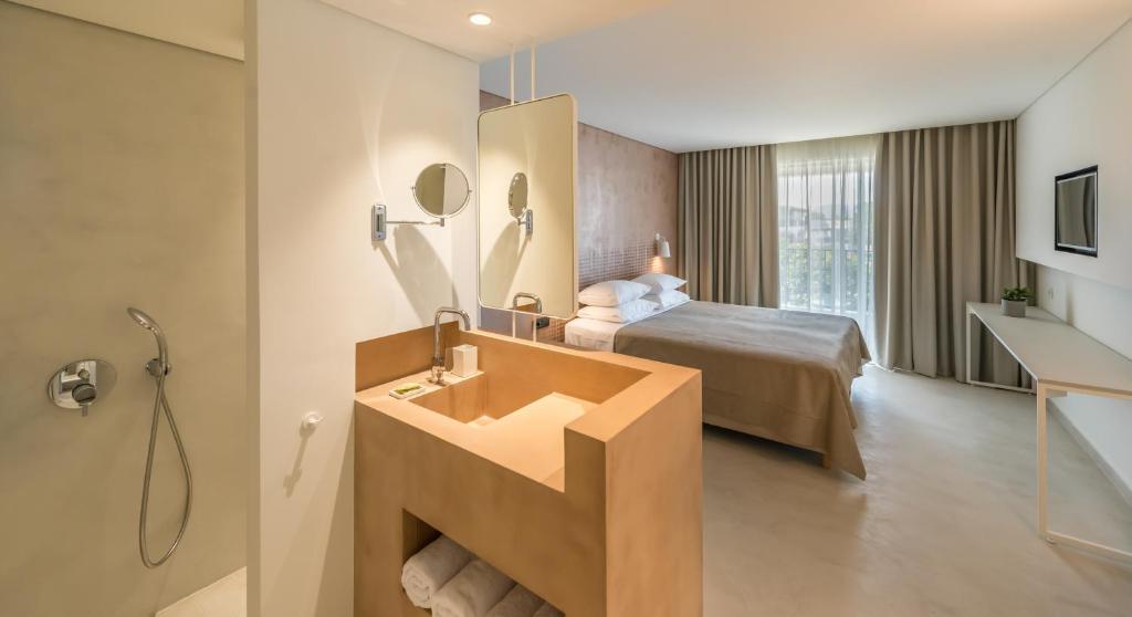 Postelja oz. postelje v sobi nastanitve Bitzaro Grande Hotel & Suites