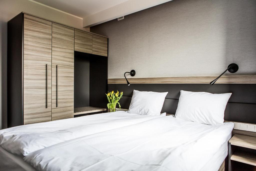Postel nebo postele na pokoji v ubytování Hotel Mazurek