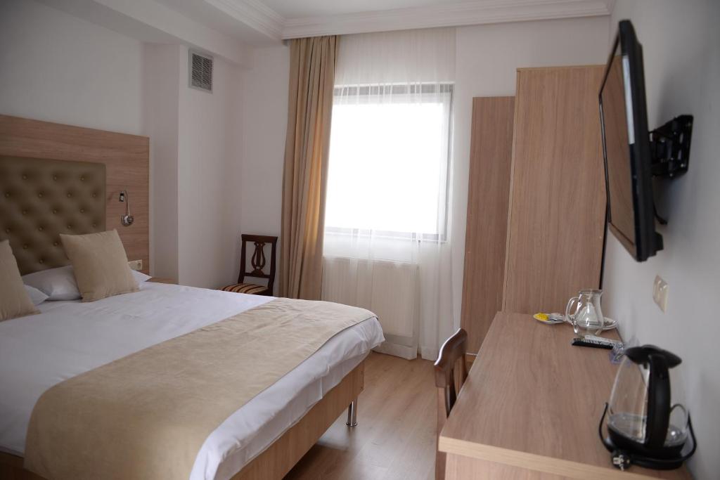 Postel nebo postele na pokoji v ubytování Hotel Varios