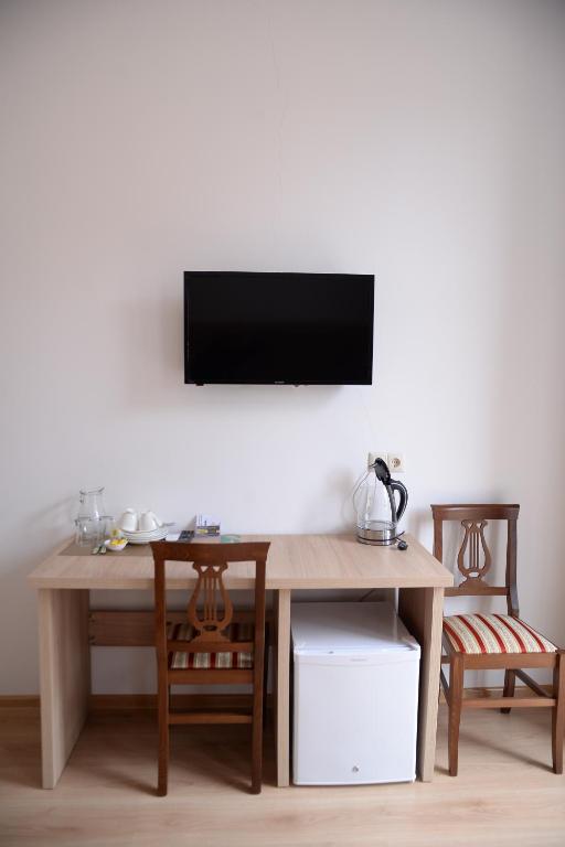 TV a/nebo společenská místnost v ubytování Hotel Varios
