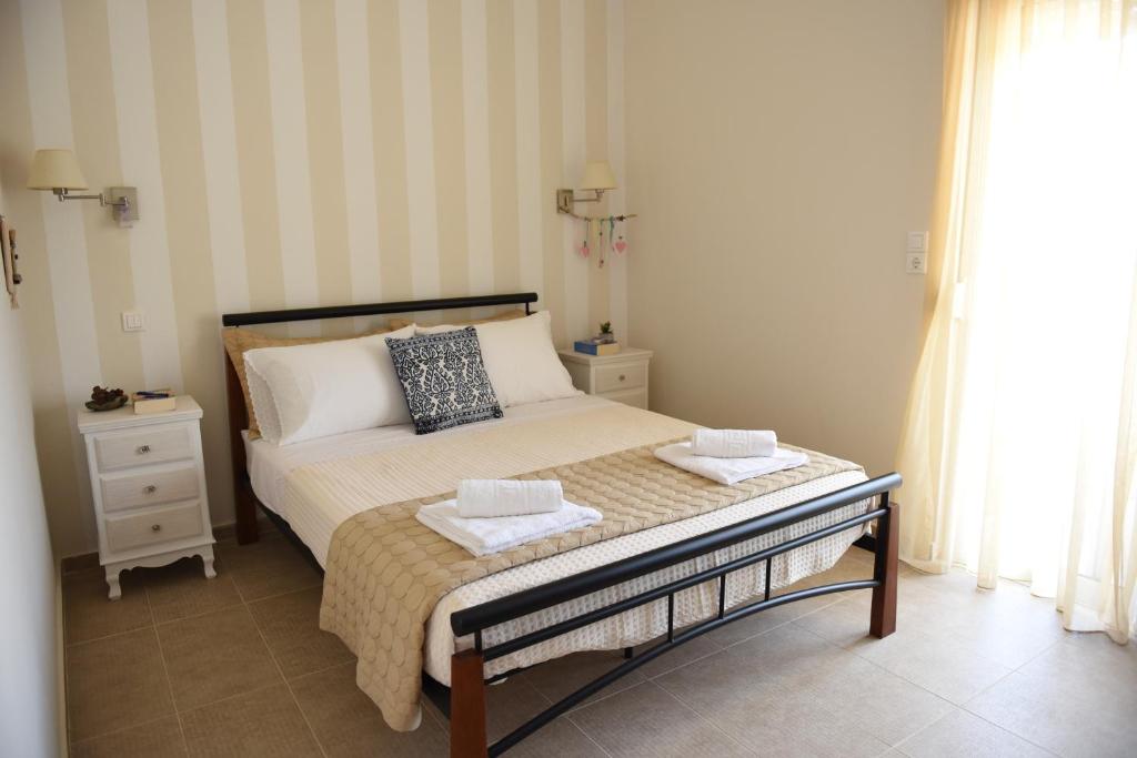 A bed or beds in a room at Dimitris' & Valentina's Home