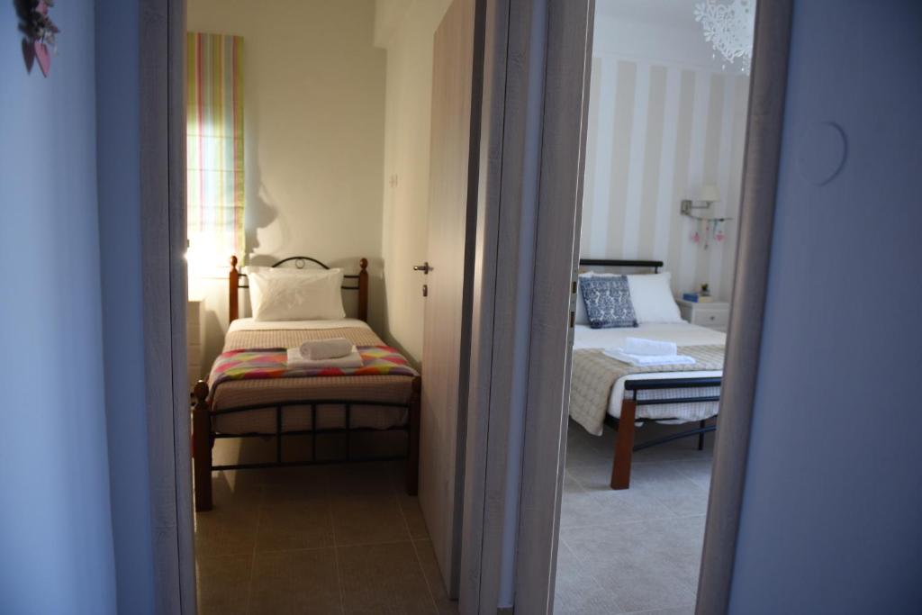 A bed or beds in a room at Dimitris' & Valentina's Home