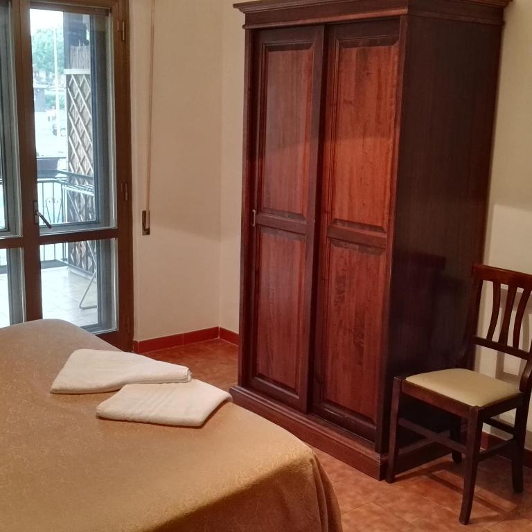 Postel nebo postele na pokoji v ubytování Hotel La Mimosa