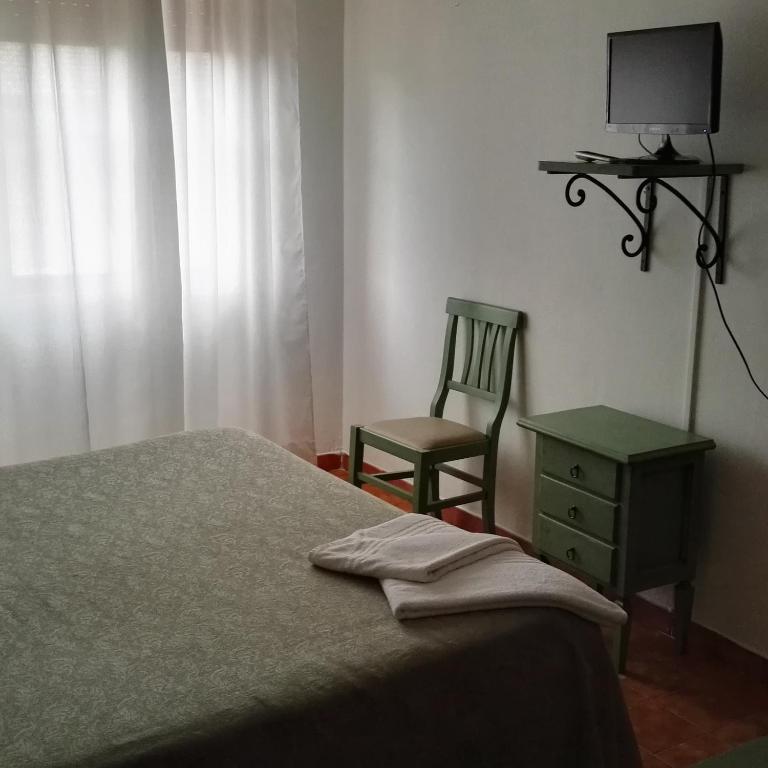 Postel nebo postele na pokoji v ubytování Hotel La Mimosa