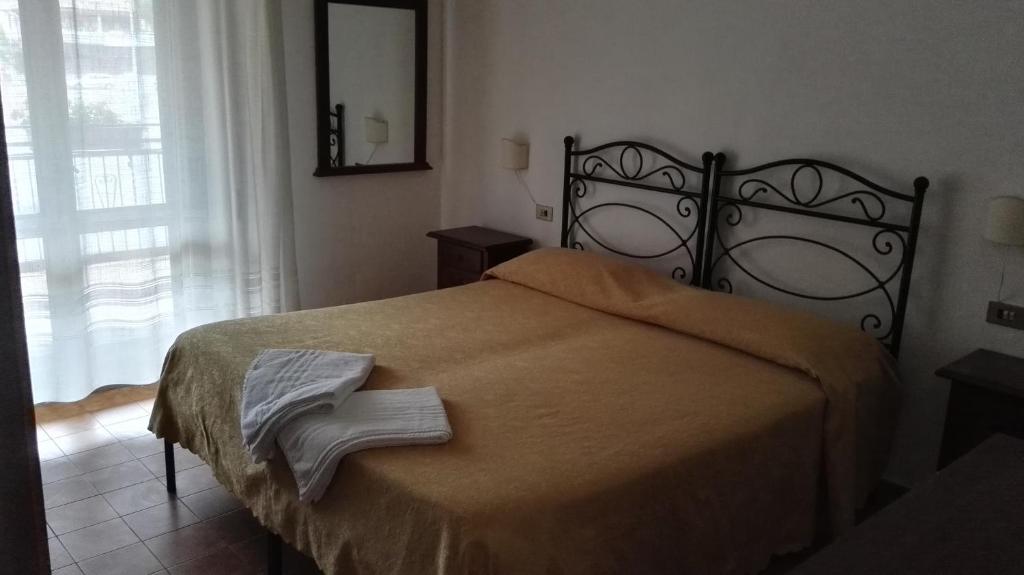 Postel nebo postele na pokoji v ubytování Hotel La Mimosa