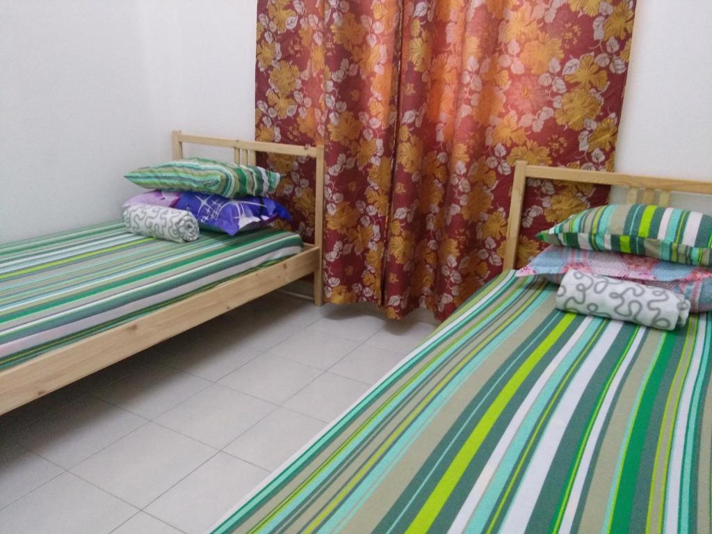 Postel nebo postele na pokoji v ubytování HomeStay D 11 Putrajaya NETFLIX WIFI
