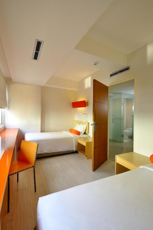 Postel nebo postele na pokoji v ubytování HARRIS Hotel & Residences Riverview Kuta, Bali