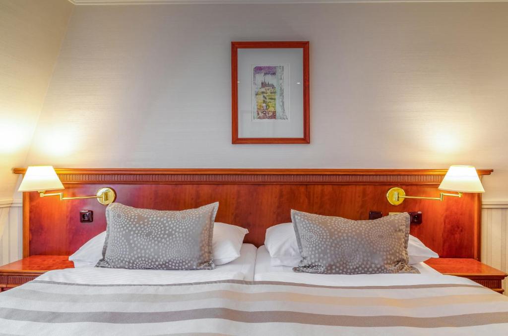 Postel nebo postele na pokoji v ubytování Adria Hotel Prague