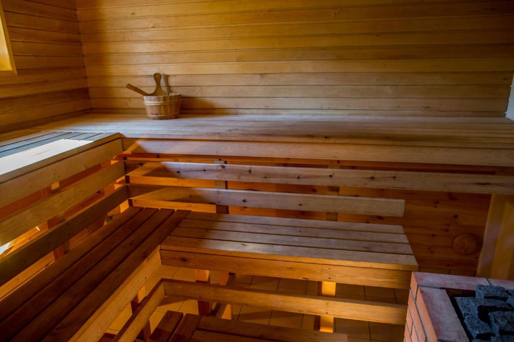 an inside of a wooden sauna with wooden floors at Holiday Home with Sauna in Kassari