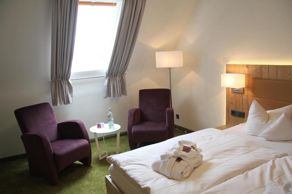 Postel nebo postele na pokoji v ubytování Hotel Tannhof