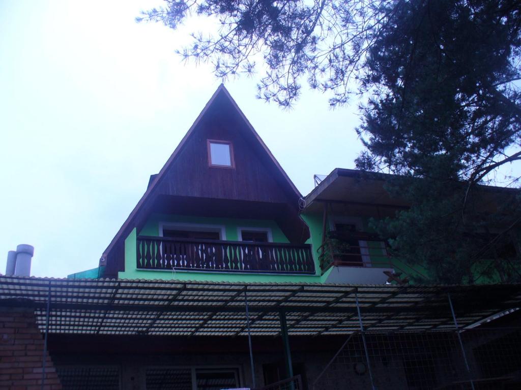 a house with a balcony on top of it at Piteľová-Babica in Pitelová