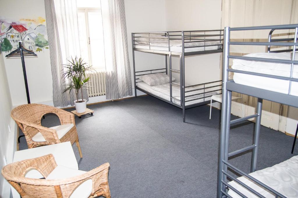 Una cama o camas en una habitación de Hostel Franz Kafka