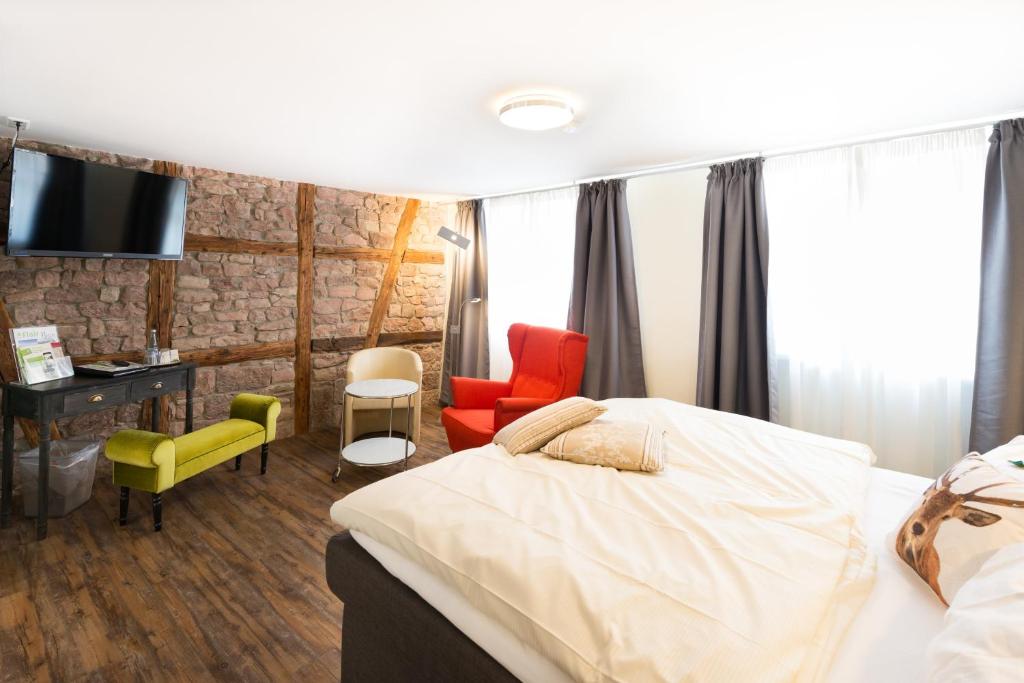 Postel nebo postele na pokoji v ubytování Flair Hotel Hopfengarten