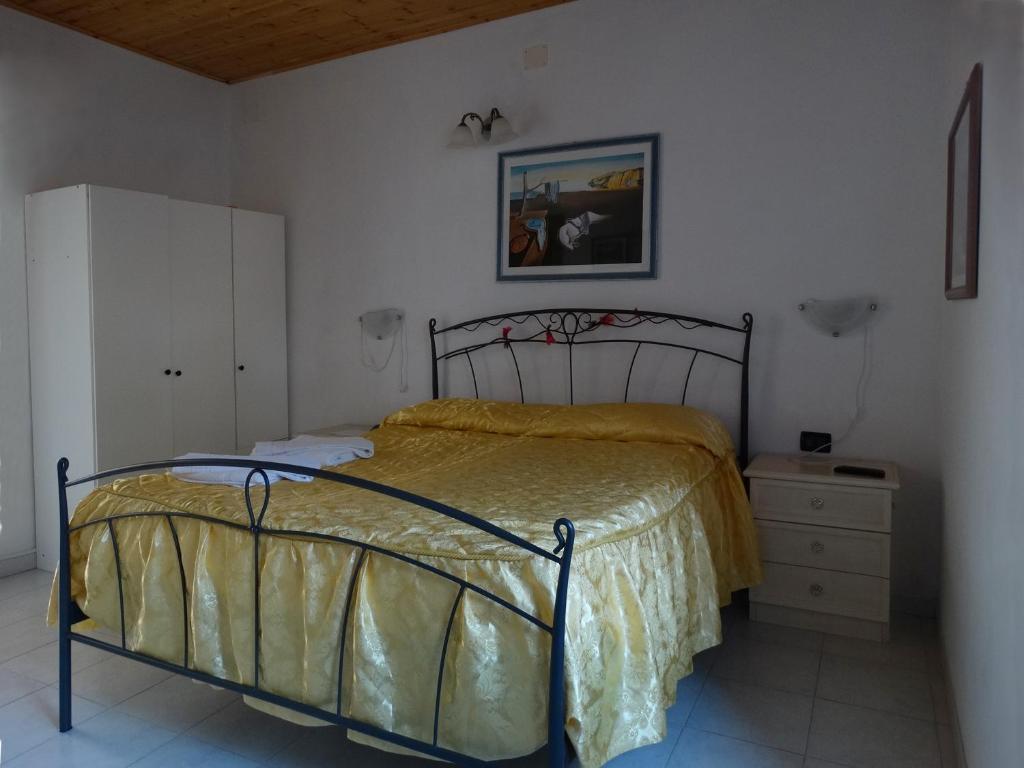 Postel nebo postele na pokoji v ubytování Affittacamere Graziella